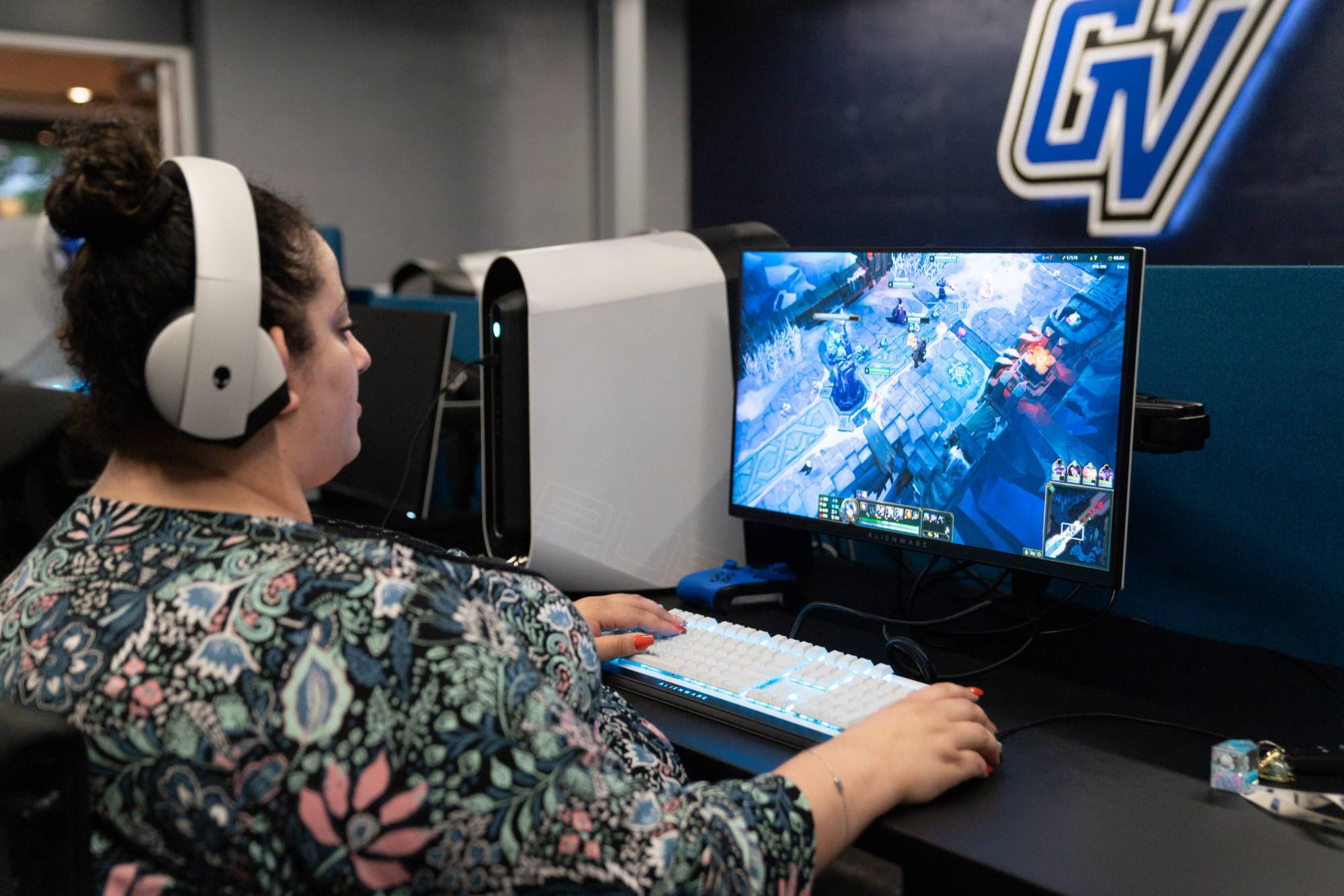 Student at Grand Valley playing games in the Esports Room